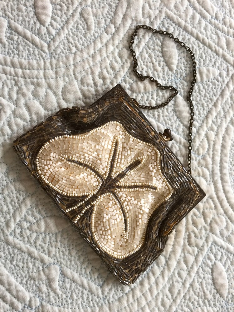 This bag is, apparently, French, and is beaded in the Art Nouveau style on both sides, with tiny bugle beads.